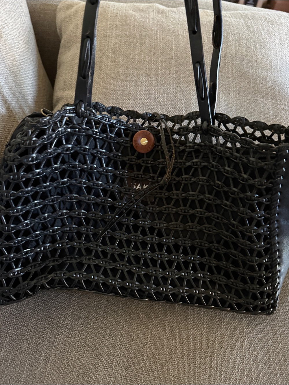 The SAK Woven Black leather Tote Bag with leather woven straps